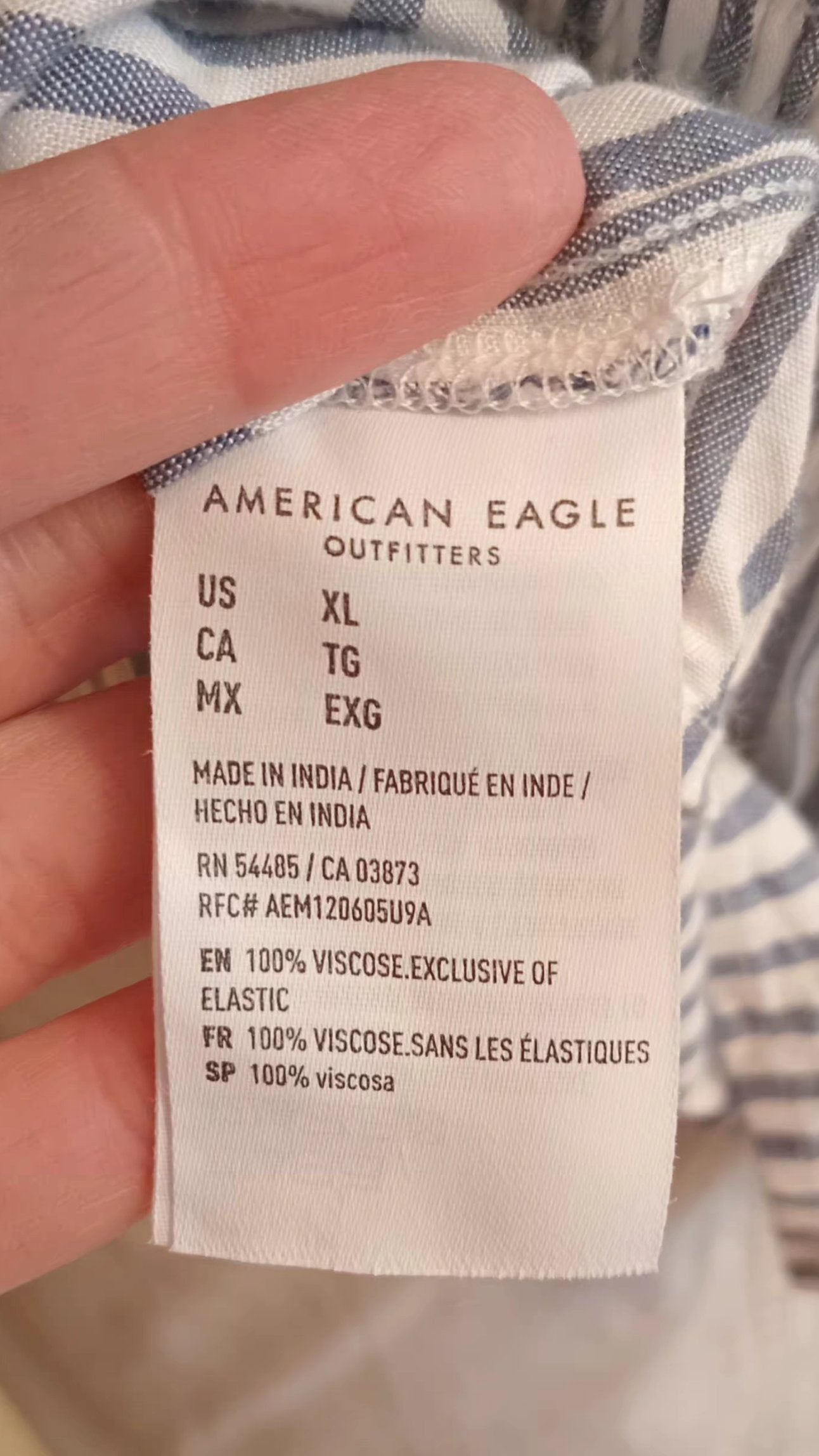 Camisole rayée blanc et bleu avec jolie boucle